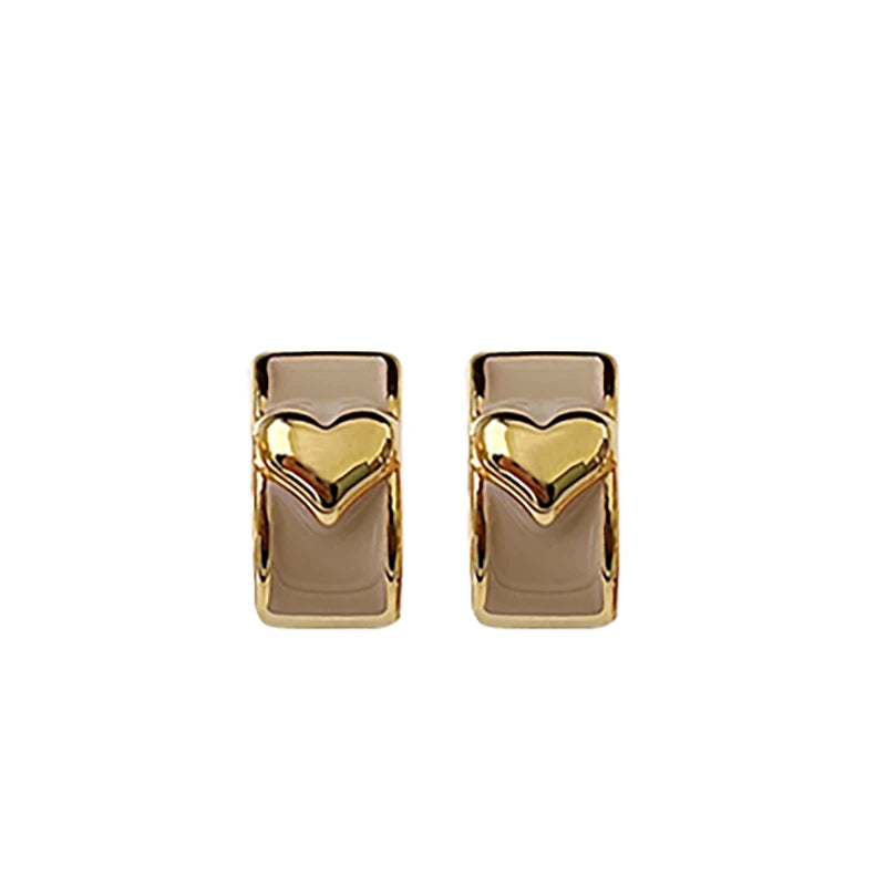 2025 Girl’s New French Enamel Metal Heart shaped Ear Buckles   ChatGPT said: ChatGPT أقراط مشبك على شكل قلب من المينا المعدني بتصميم فرنسي جديد لعام 2025 للفتيات